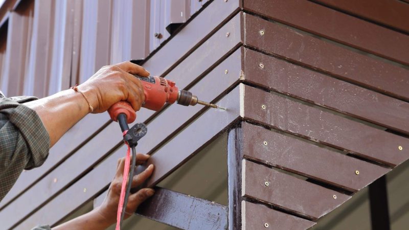 person-working-metal-wall
